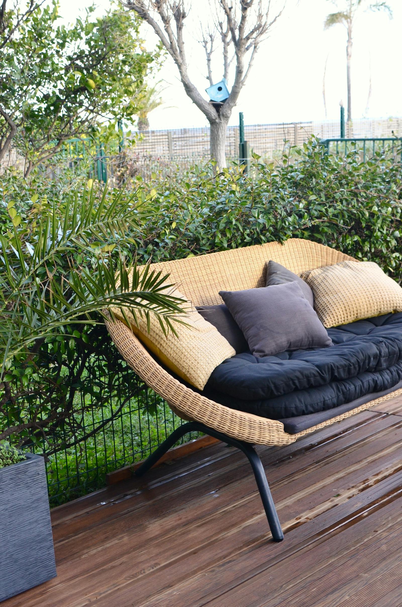 Wicker seating detail from a covered patio design